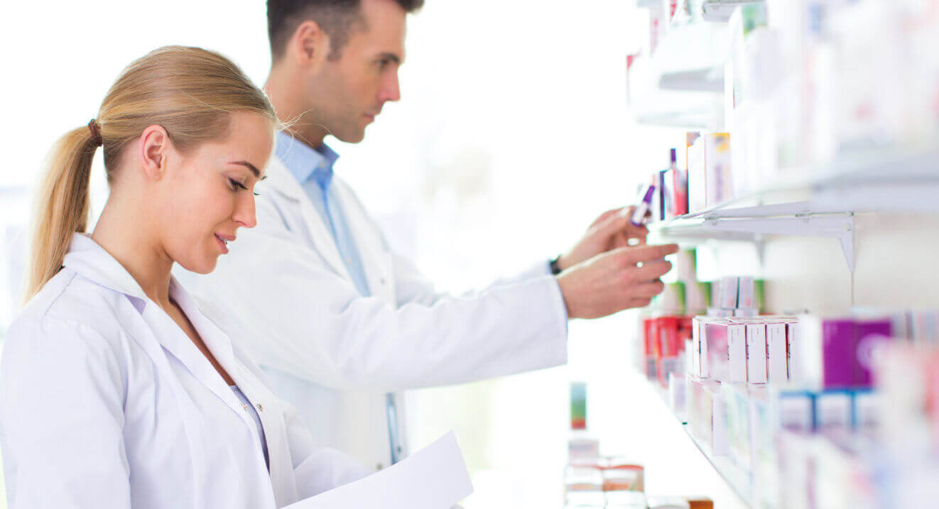 pharmacists checking out medicine bottles