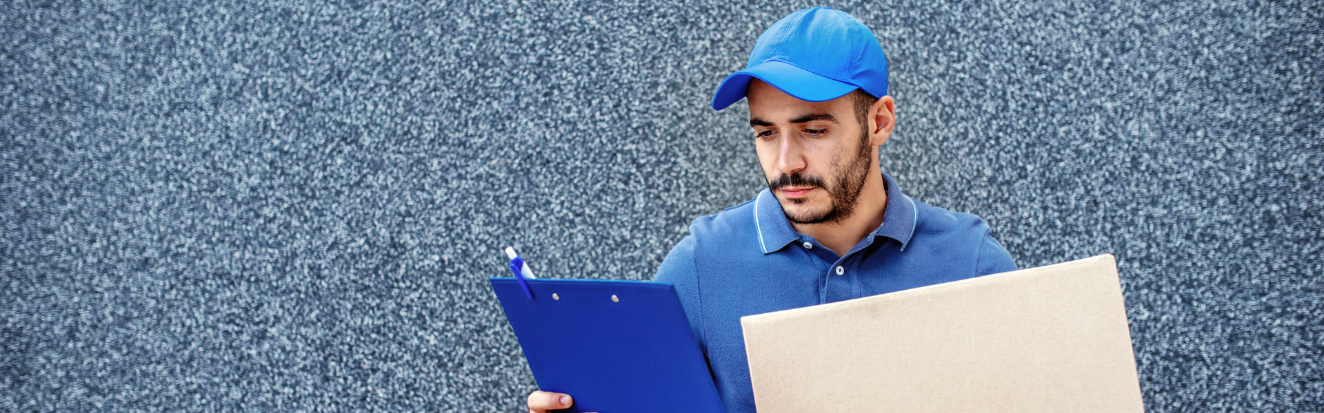 delivery guy looking at his clipboard