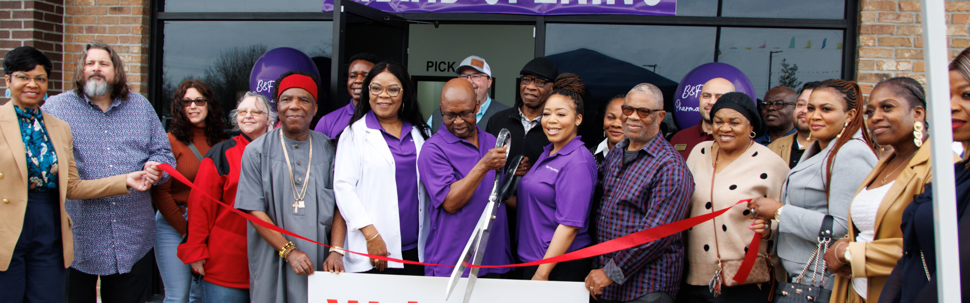 B & F Pharmacy doing ribbon cutting